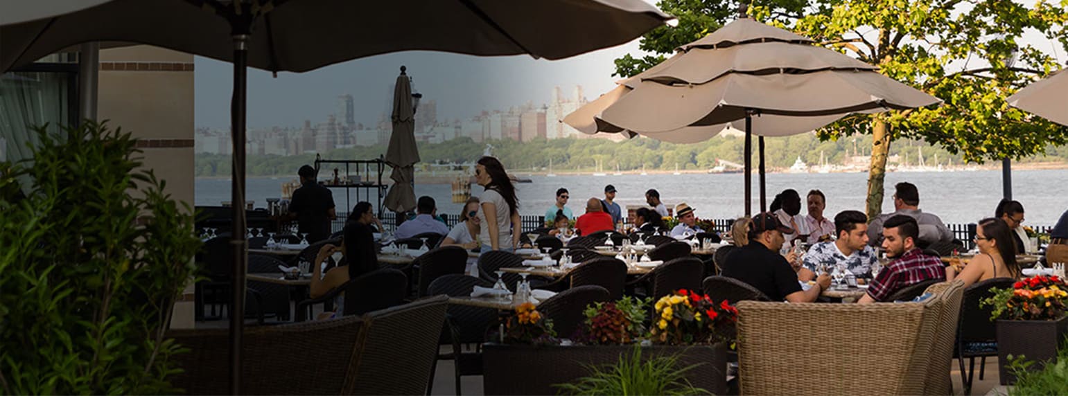 Outdoor diners on patio at waterfront restaurant