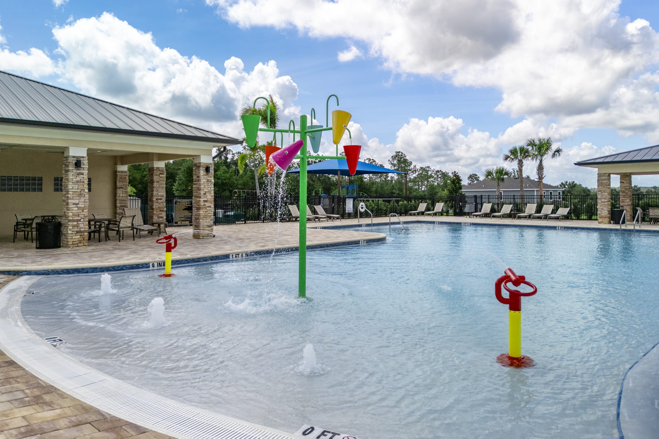 Cool off in the zero-entry pool & splash zone! | Eagletail Landings | New Homes in Leesburg, FL | Landsea Homes