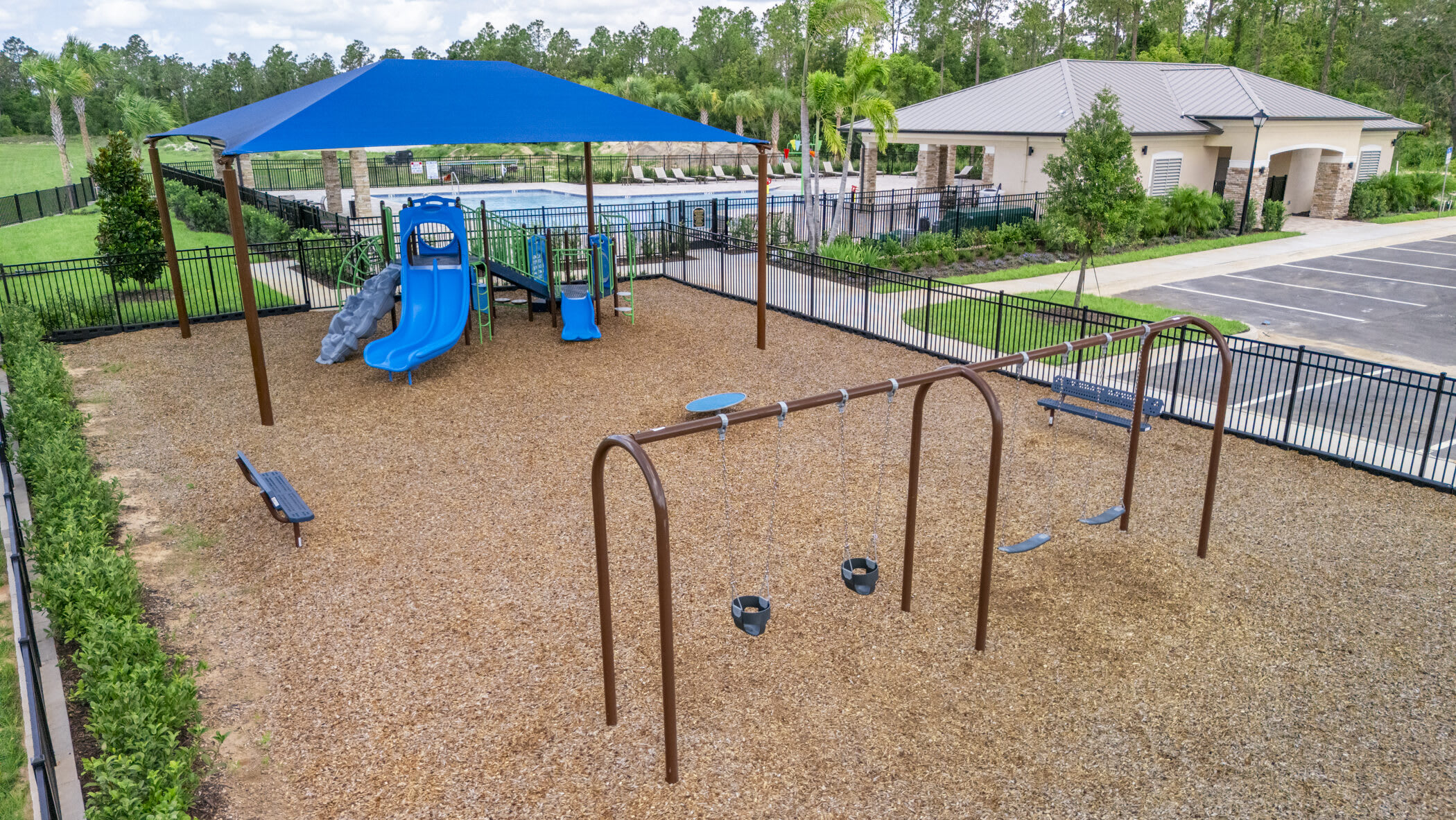 Kiddos can enjoy the swings and covered playground by the pool! | Eagletail Landings | New Homes in Howey-in-the-Hills, FL | Landsea Homes