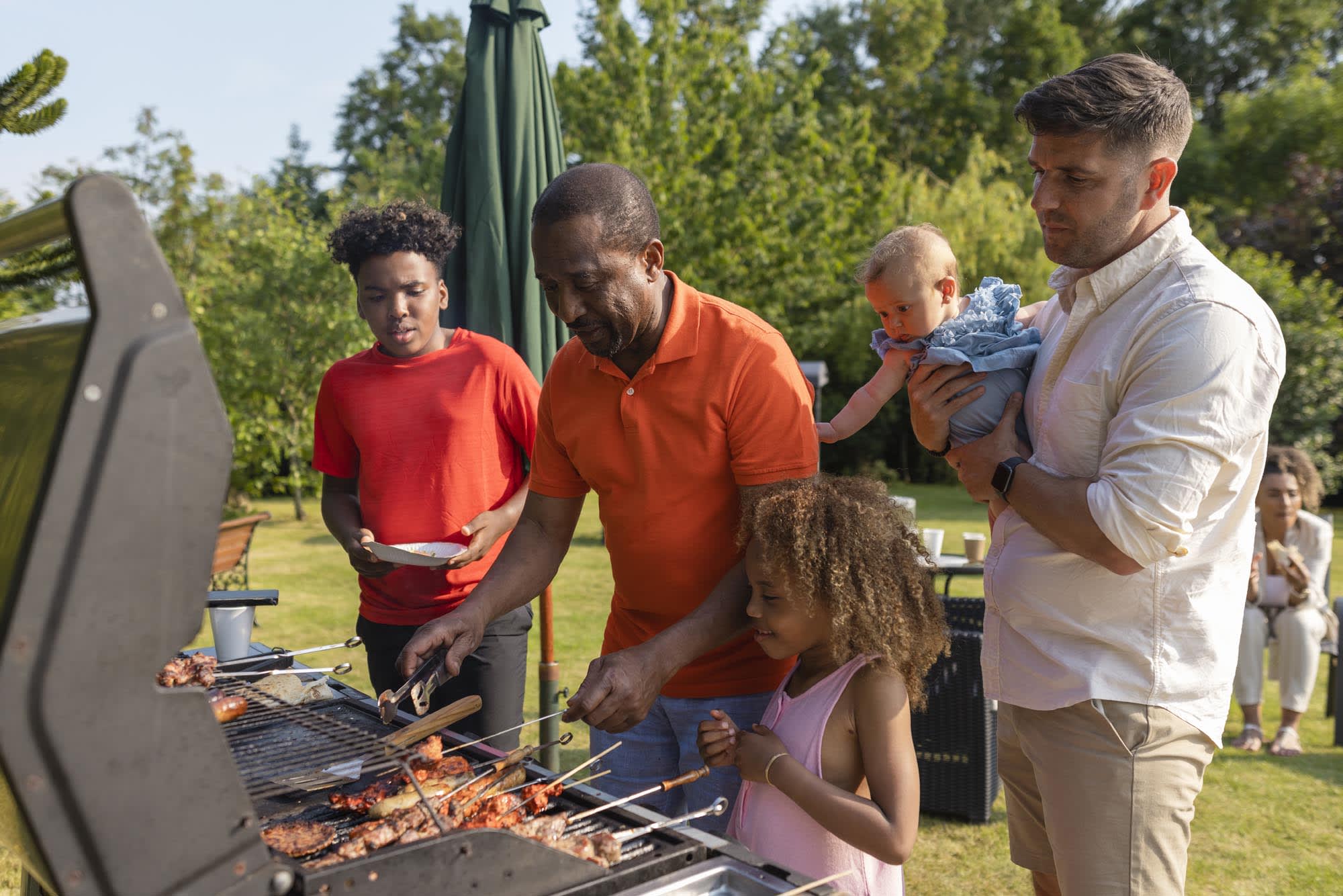 Open green spaces and grills in the community | Harrell Oaks in Orlando, FL | Landsea Homes