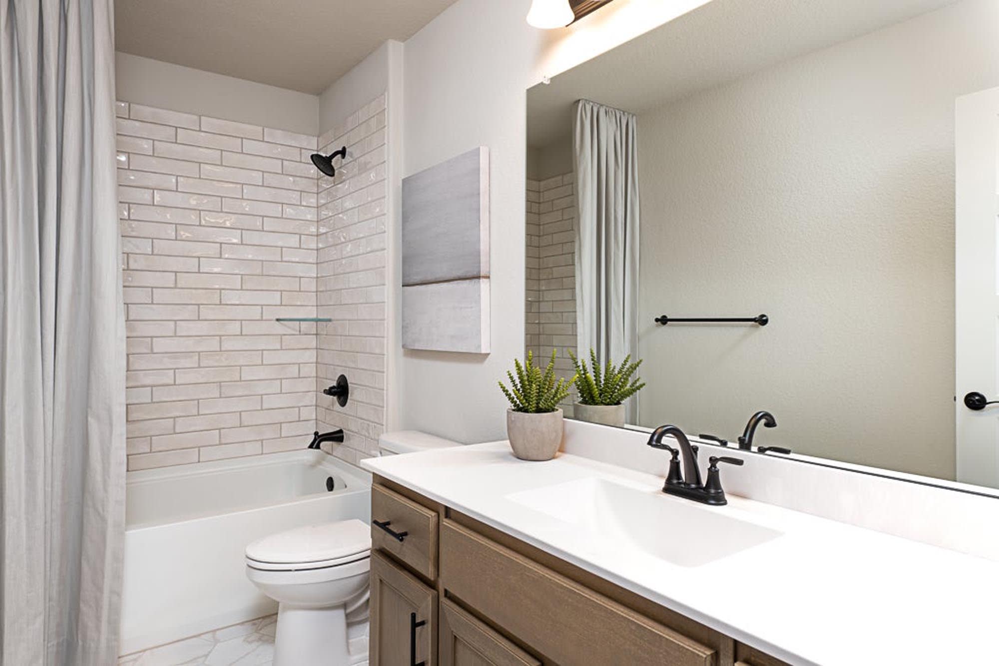 Bathroom | Concept 3135 at Coyote Crossing in Godley, TX by Landsea Homes