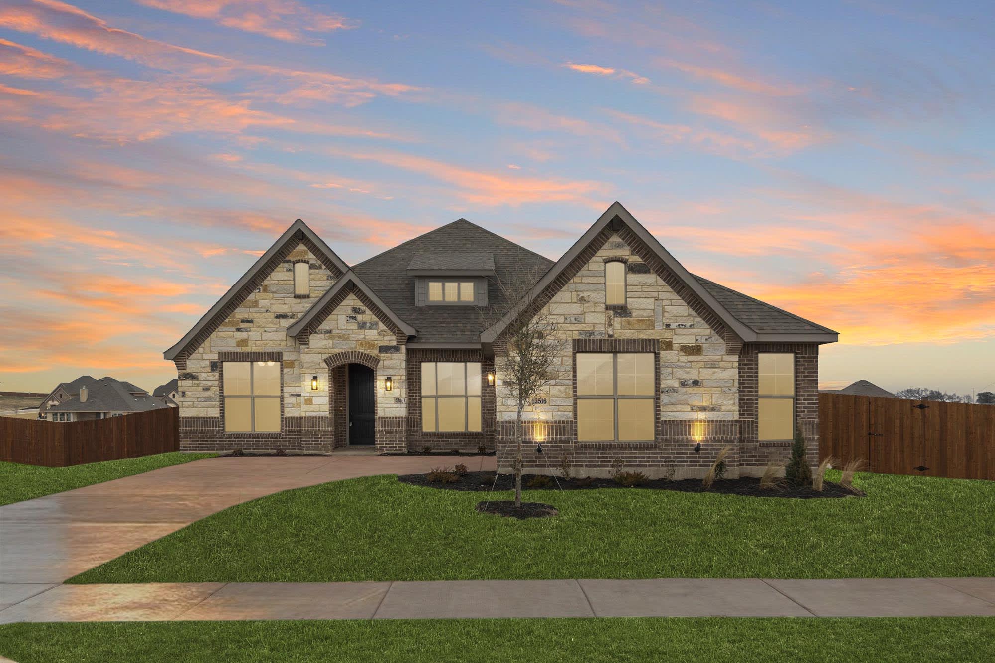Elevation B with Stone | Concept 2370 at Coyote Crossing in Godley, TX by Landsea Homes