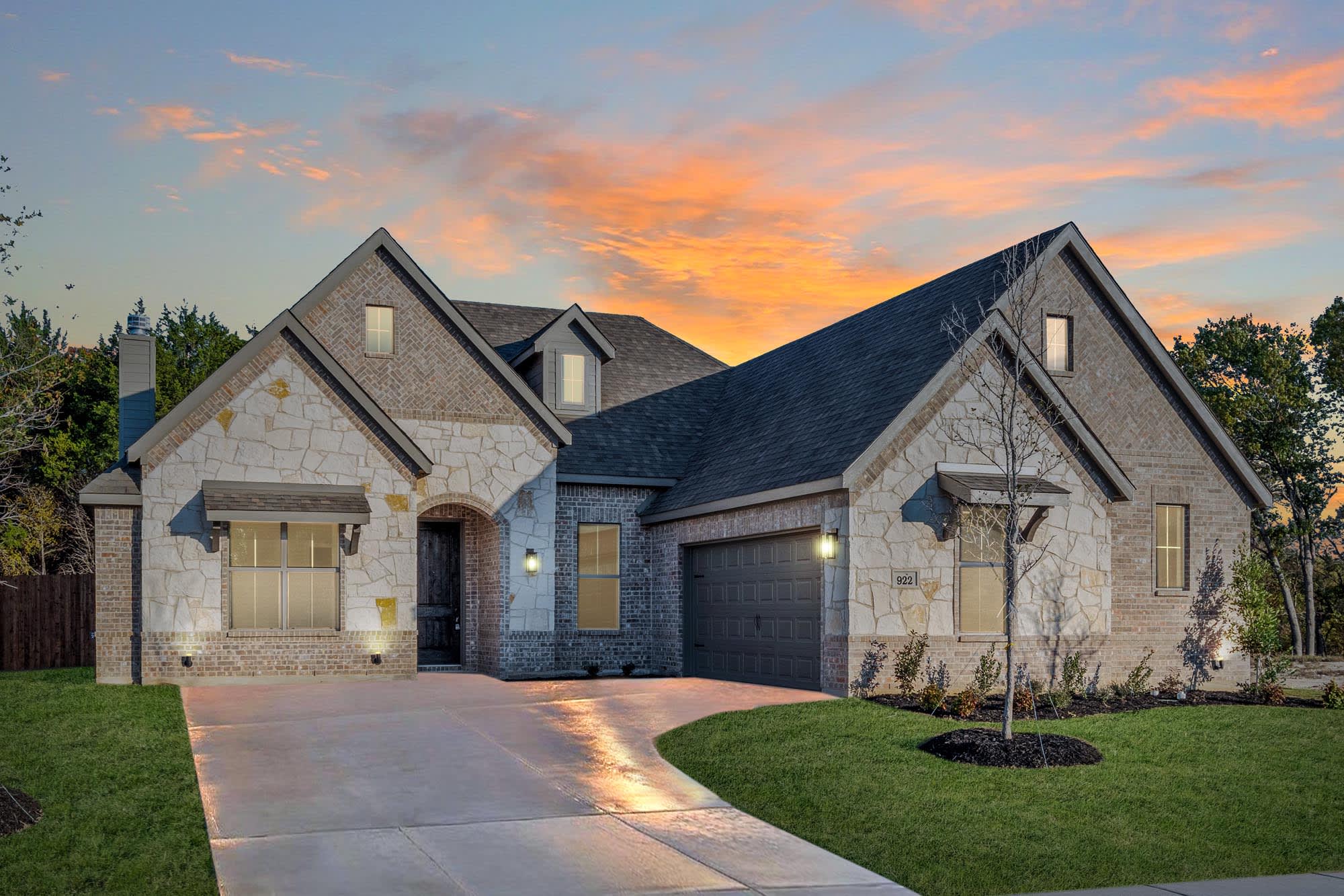 Elevation B with Stone | Concept 2050 at Coyote Crossing in Godley, TX by Landsea Homes