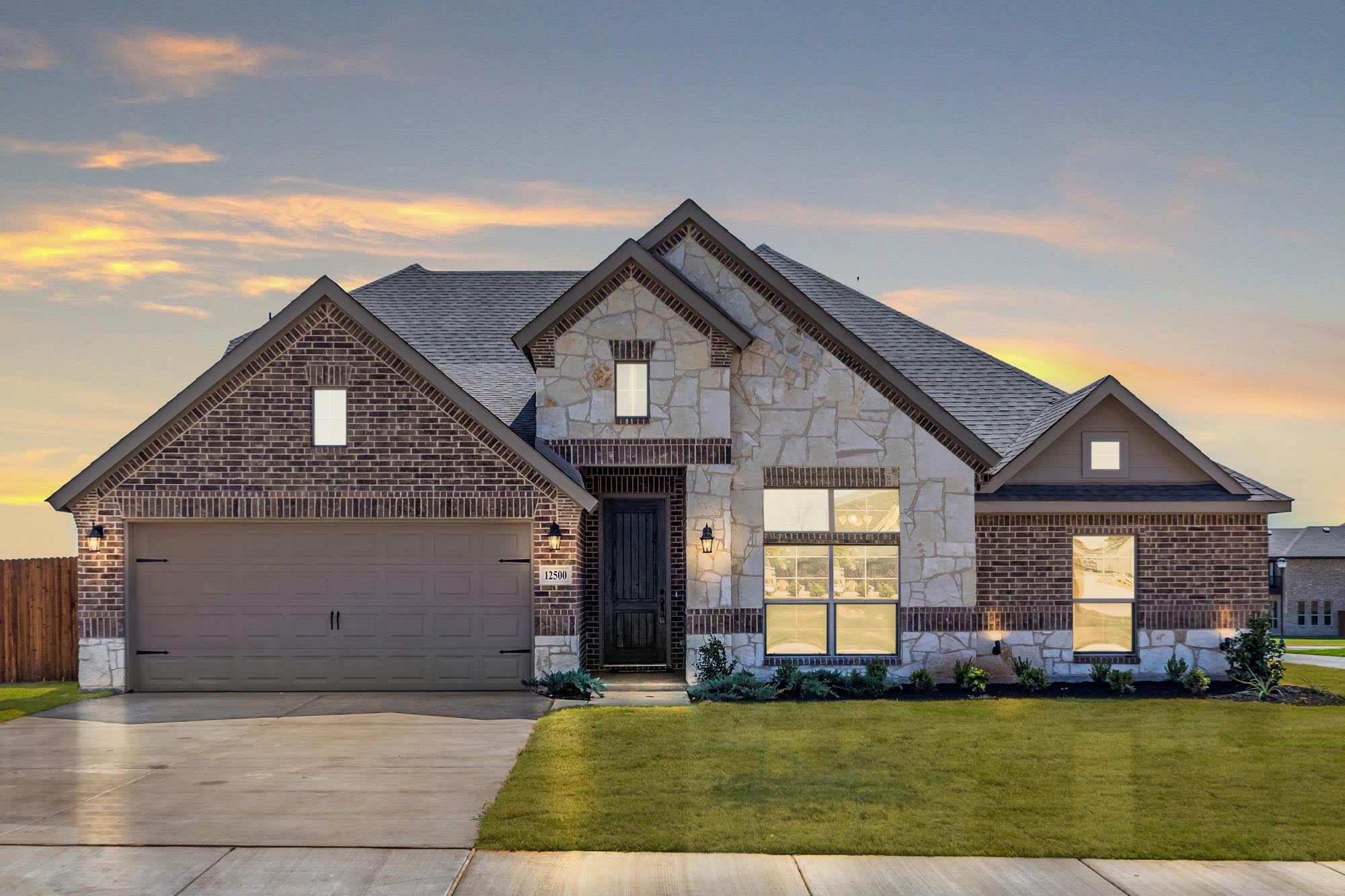 Elevation C with Stone | Concept 2393 at Coyote Crossing in Godley, TX by Landsea Homes
