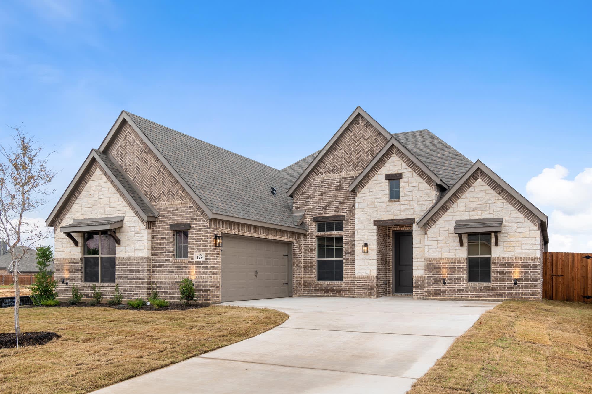 Elevation C with Stone | Concept 2370 at Oak Hills in Burleson, TX by Landsea Homes
