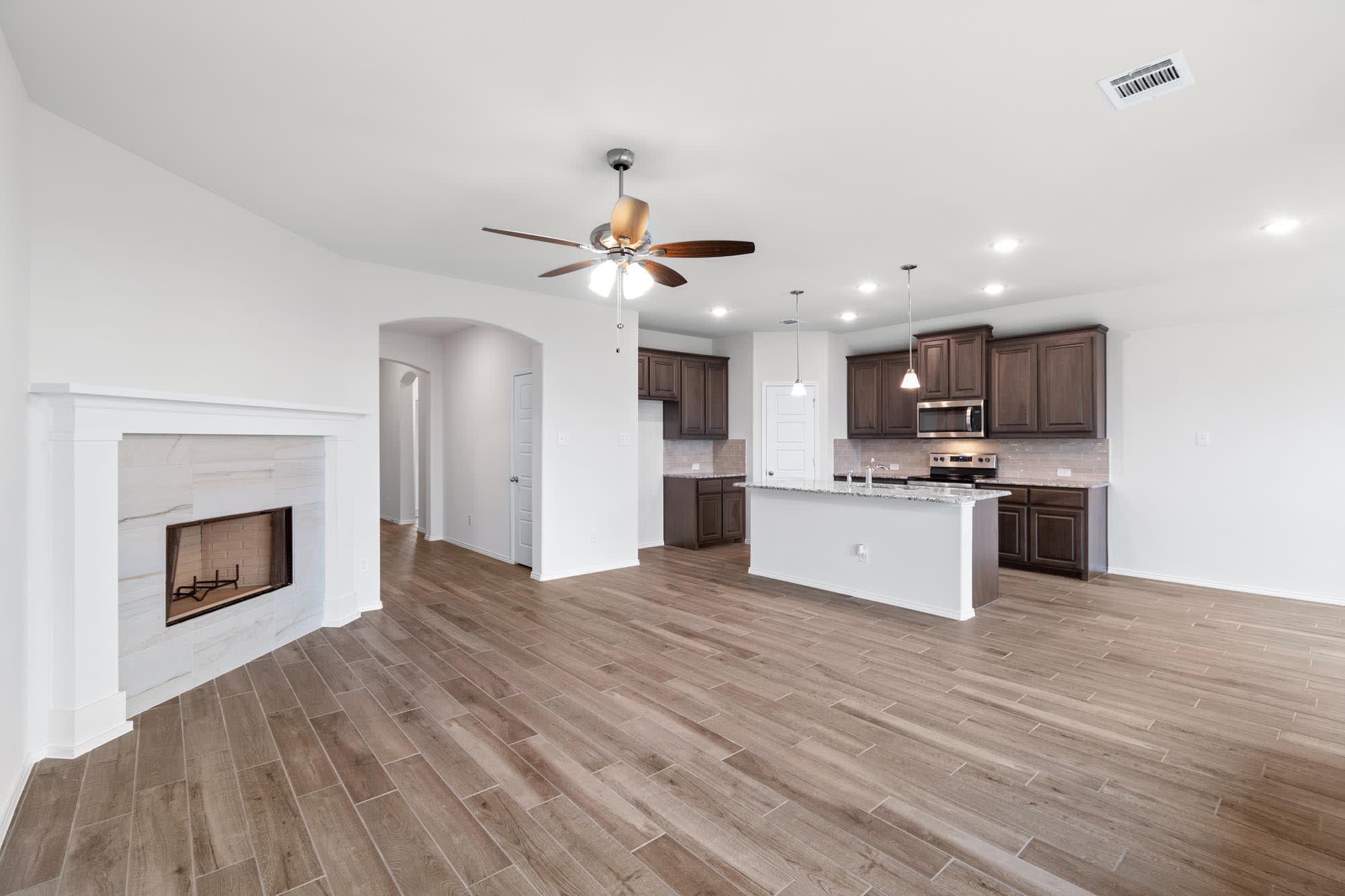 Family Room & Kitchen | Concept 1660 at Hulen Trails in Fort Worth, TX by Landsea Homes