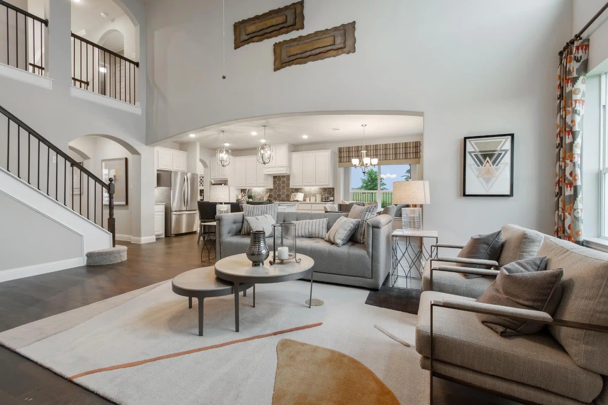 Family Room & Kitchen | Concept 3135 at Abe's Landing in Granbury, TX by Landsea Homes