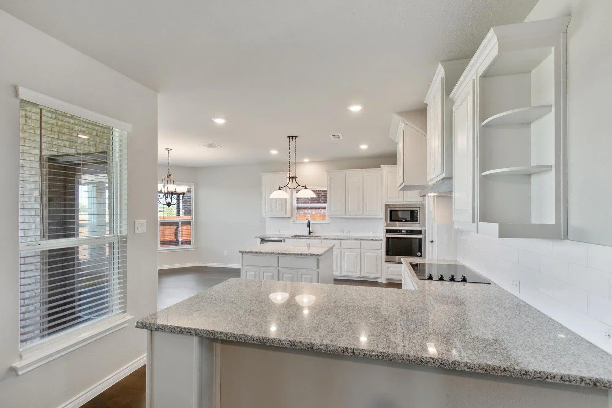Kitchen | Concept 2393 at Coyote Crossing in Godley, TX by Landsea Homes