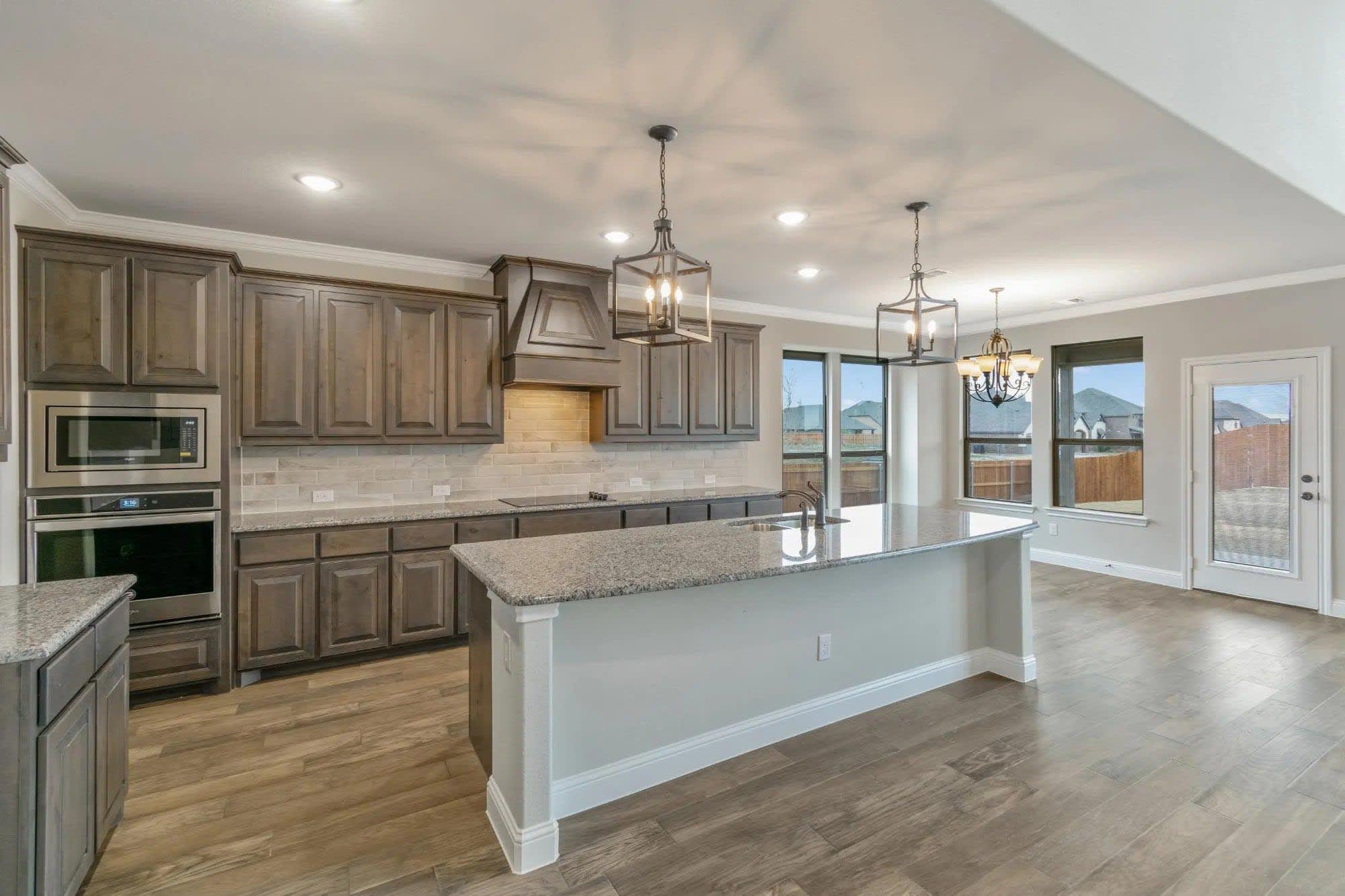 Kitchen | Concept 3218 at Mockingbird Hills in Joshua, TX by Landsea Homes
