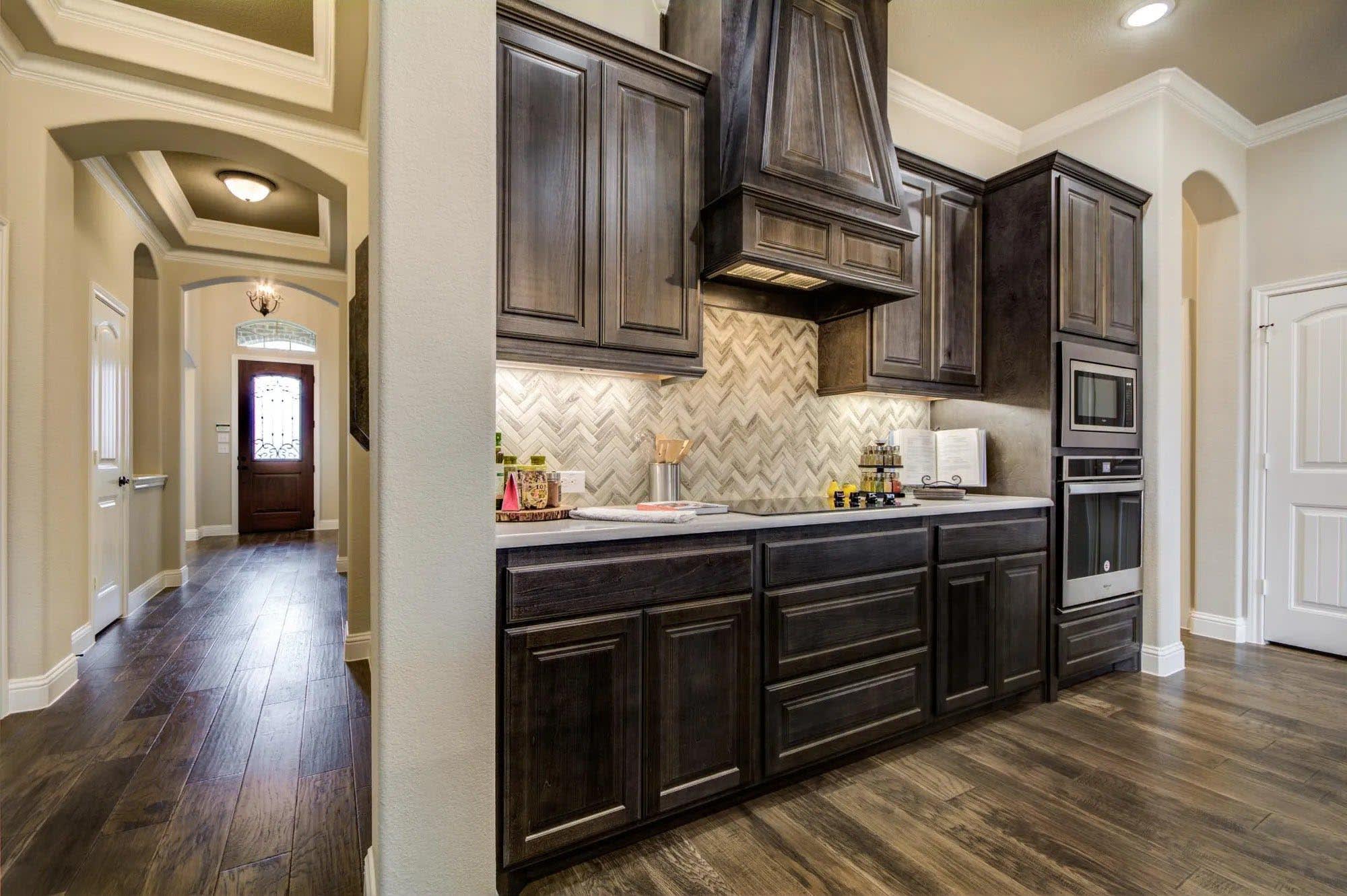 Kitchen & Entrance | Concept 2622 at Abe's Landing in Granbury, TX by Landsea Homes