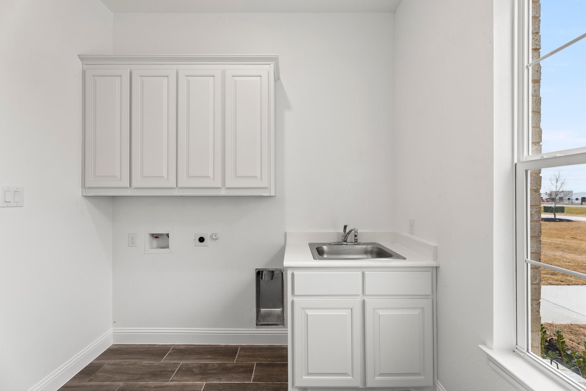 Laundry Room | Concept 2623 at Hidden Creek Estates in Van Alstyne, TX by Landsea Homes