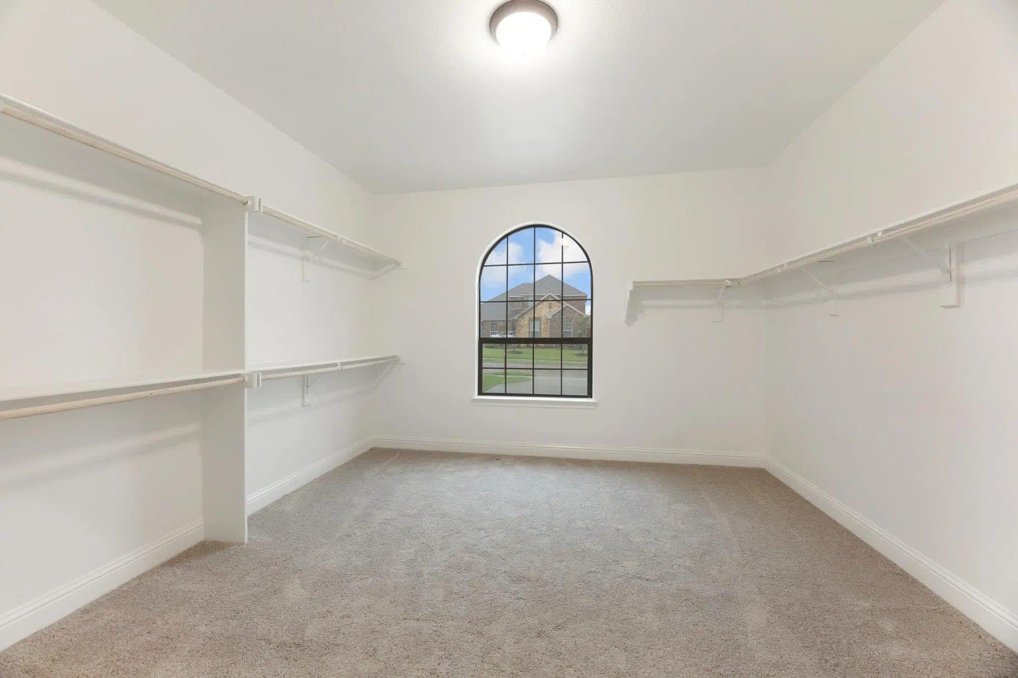 Primary Walk-In Closet | Concept 2404 at Abe's Landing in Granbury, TX by Landsea Homes