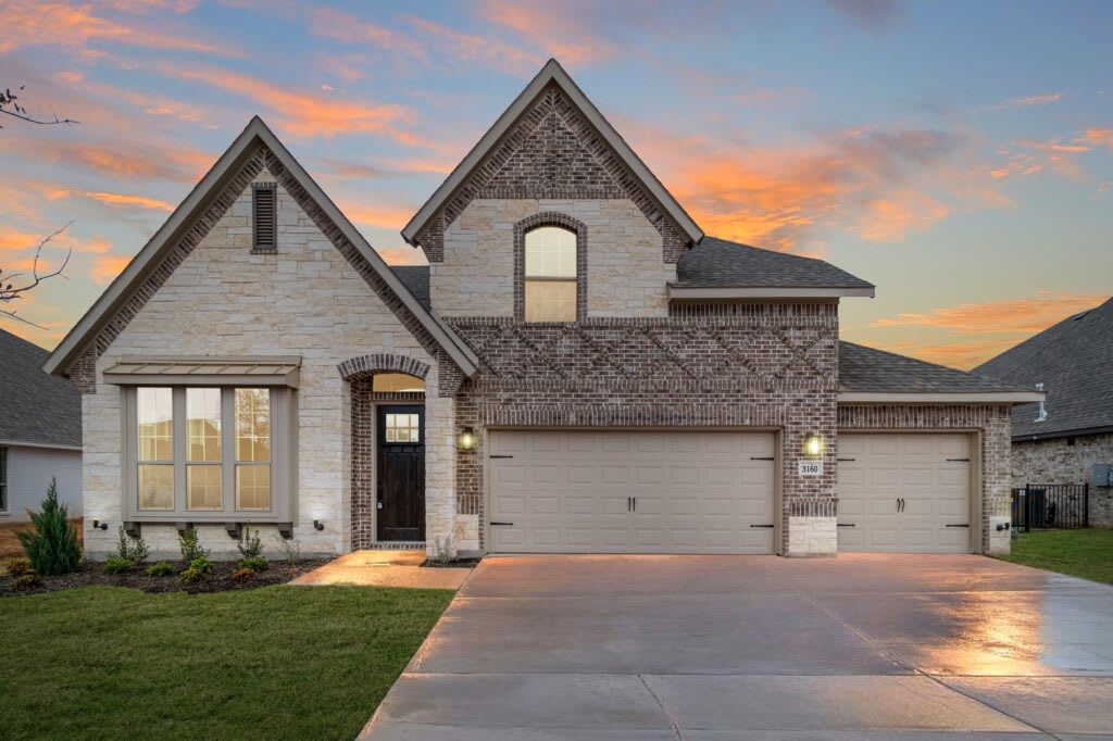 Elevation C with Stone | Concept 3015 at Belle Meadows in Cleburne, TX by Landsea Homes