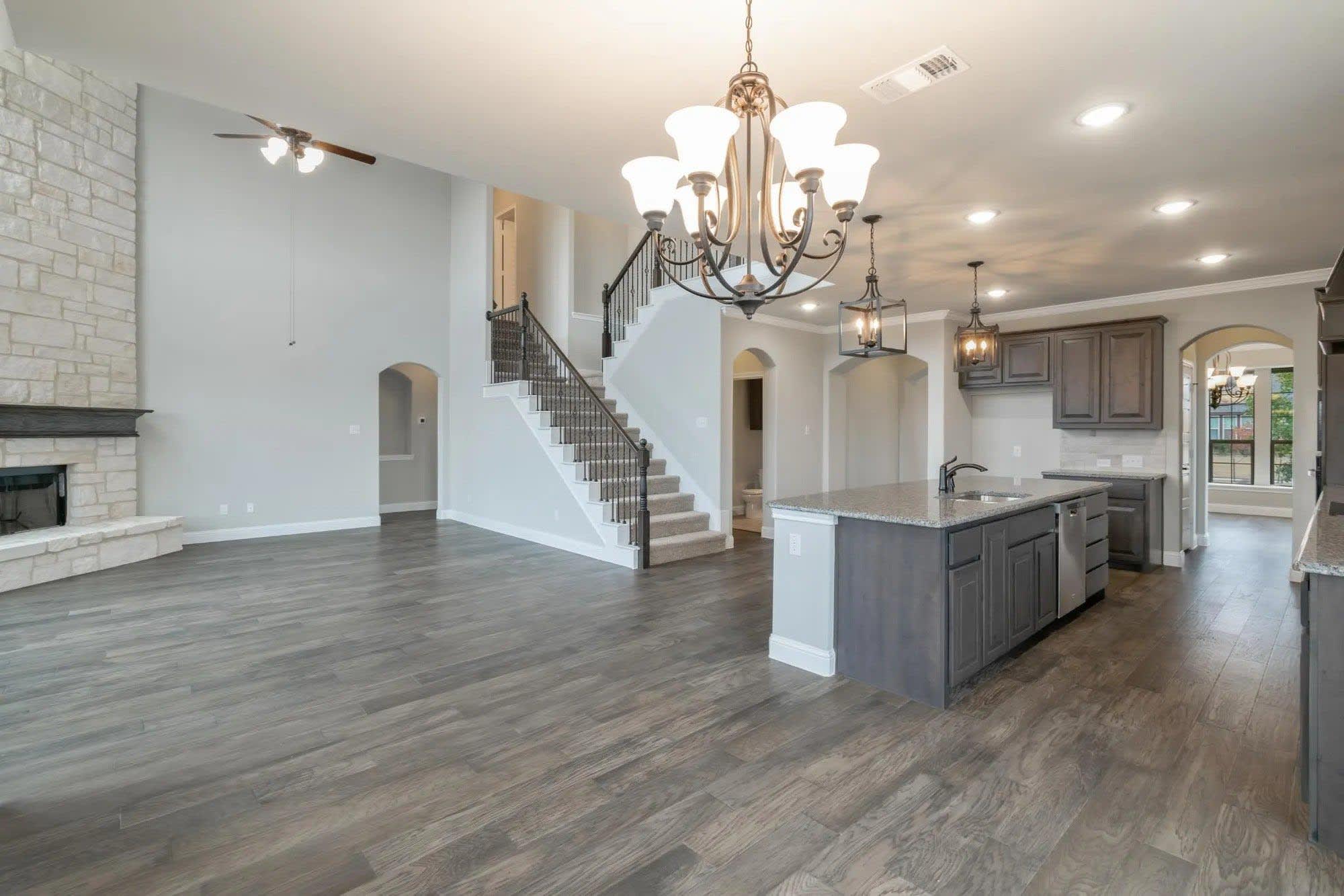 Kitchen to Family Room | Concept 3218 at Belle Meadows in Cleburne, TX by Landsea Homes