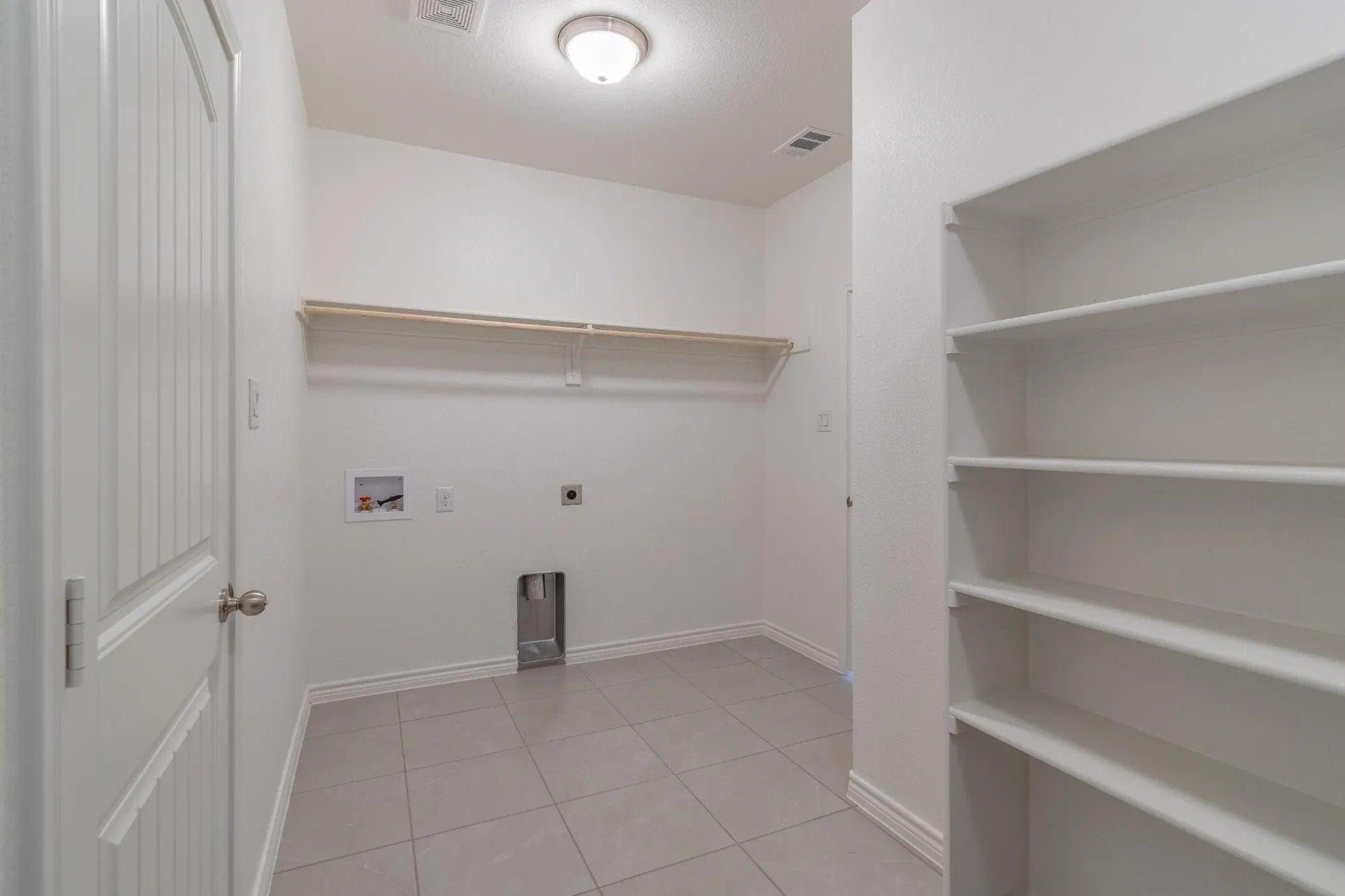 Laundry Room | Concept 2027 at Belle Meadows in Cleburne, TX by Landsea Homes