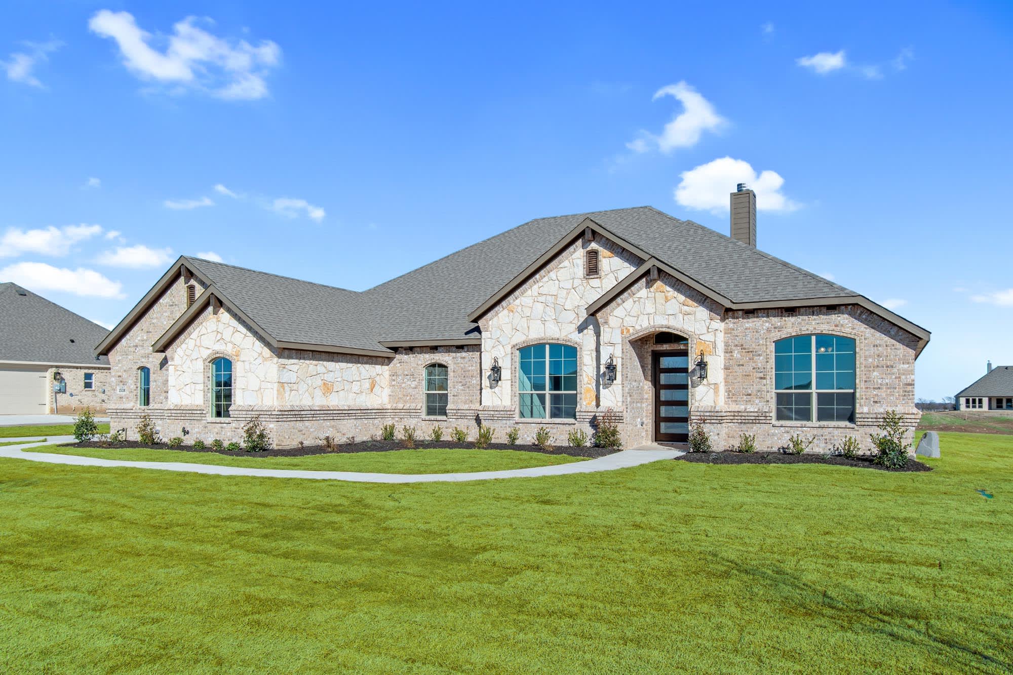 Elevation A With Stone | Concept 3141 at Mockingbird Hills in Joshua, TX by Landsea Homes