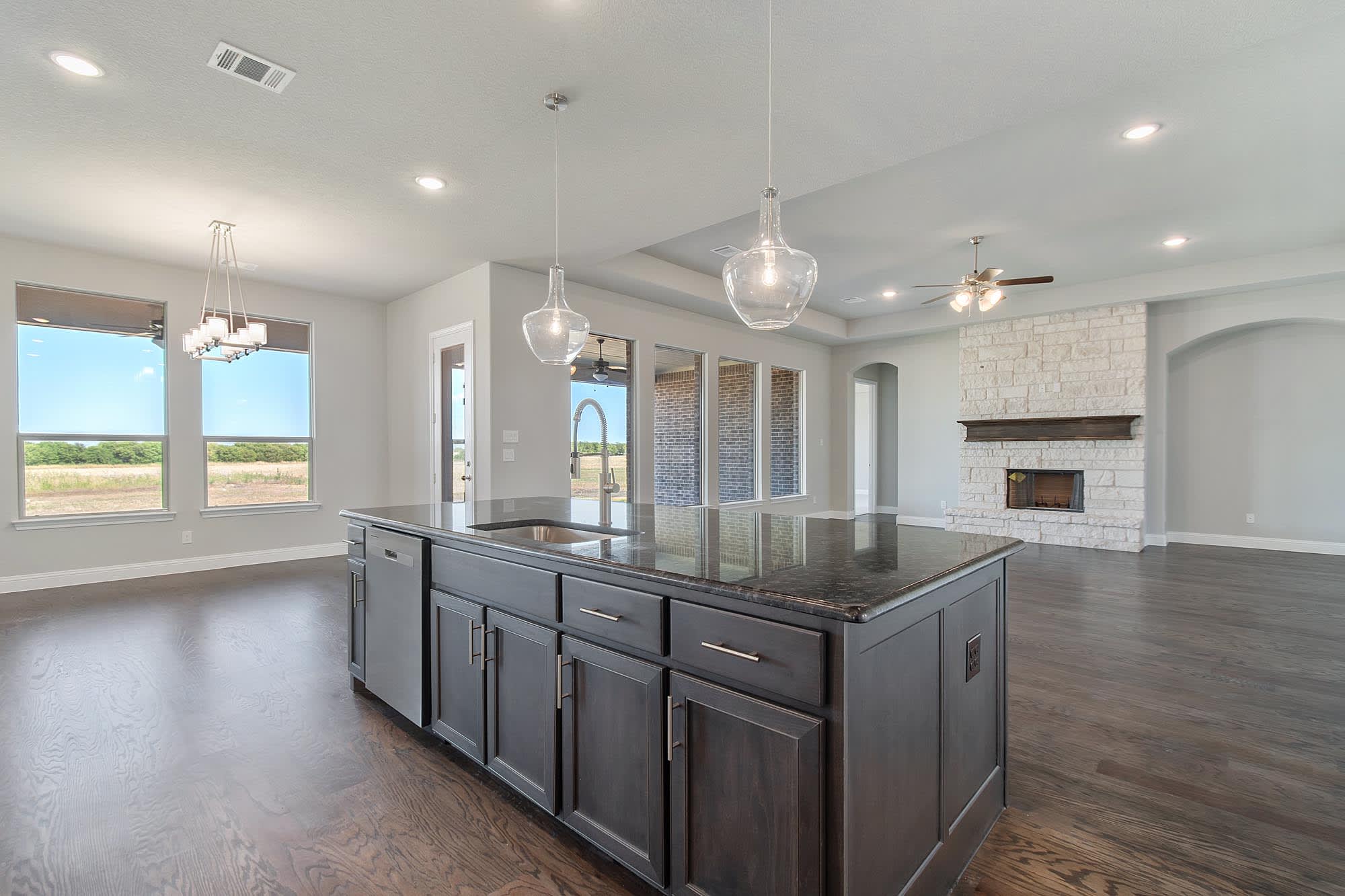 Kitchen & Family Room | Concept 3634 at Mockingbird Hills in Joshua, TX by Landsea Homes