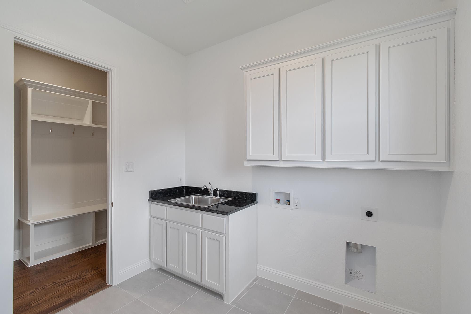 Laundry Room | Concept 3634 at Mockingbird Hills in Joshua, TX by Landsea Homes