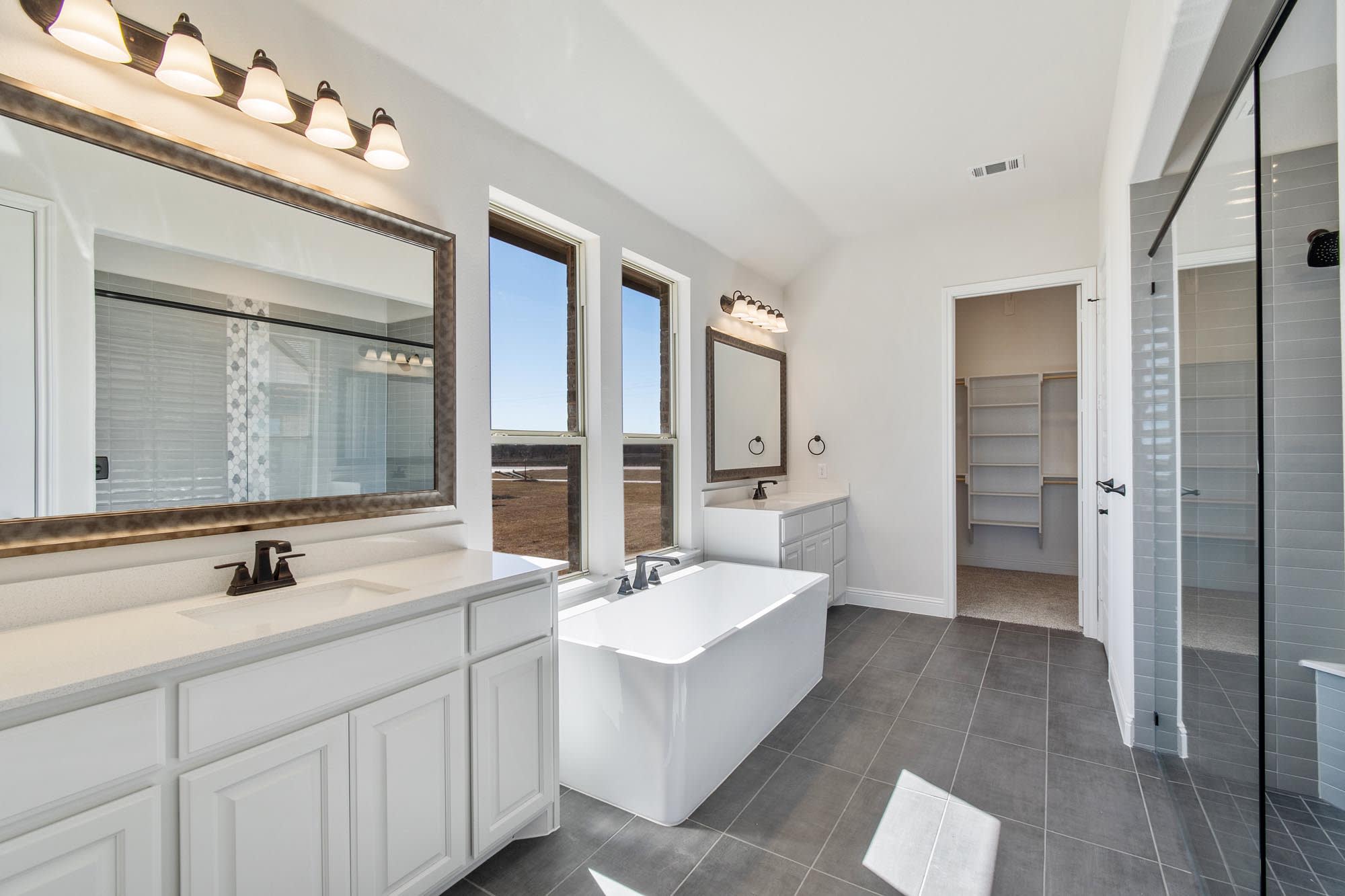 Primary Bathroom | Concept 3141 at Mockingbird Hills in Joshua, TX by Landsea Homes