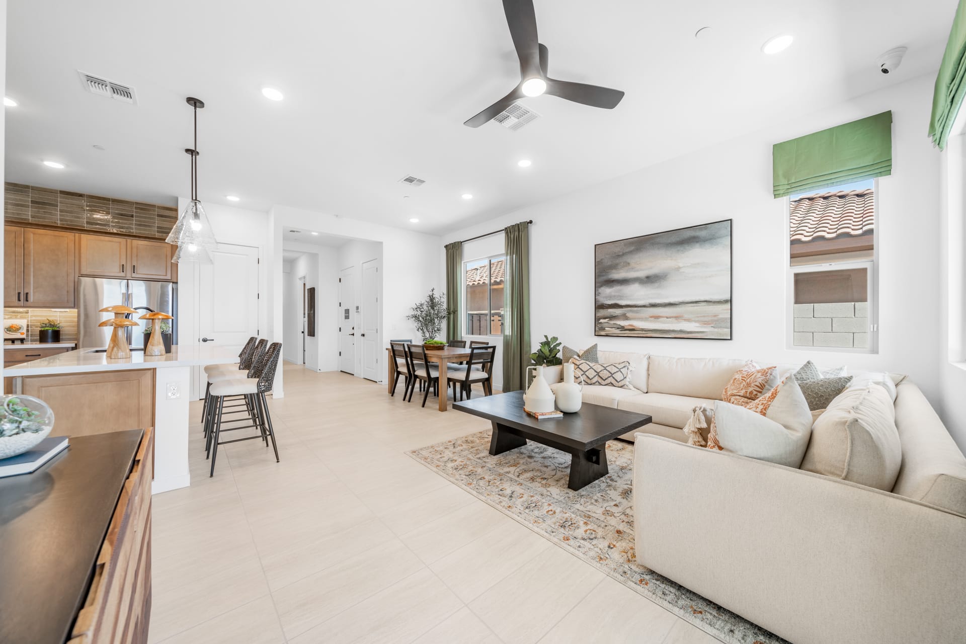 Great Room, Dining Room & Kitchen | Brisa Model Home | Mira Vista at Victory in Buckeye, AZ by Landsea Homes