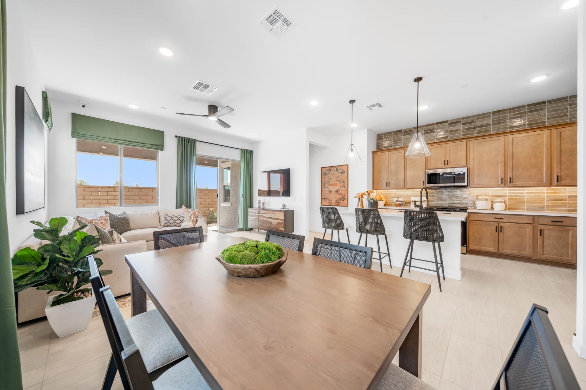 Dining Room, Great Room & Kitchen | Brisa Model Home | Mira Vista at Victory in Buckeye, AZ by Landsea Homes