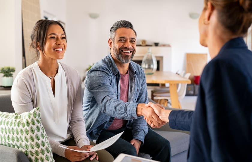 Couple shaking hands with agent – Landsea Title