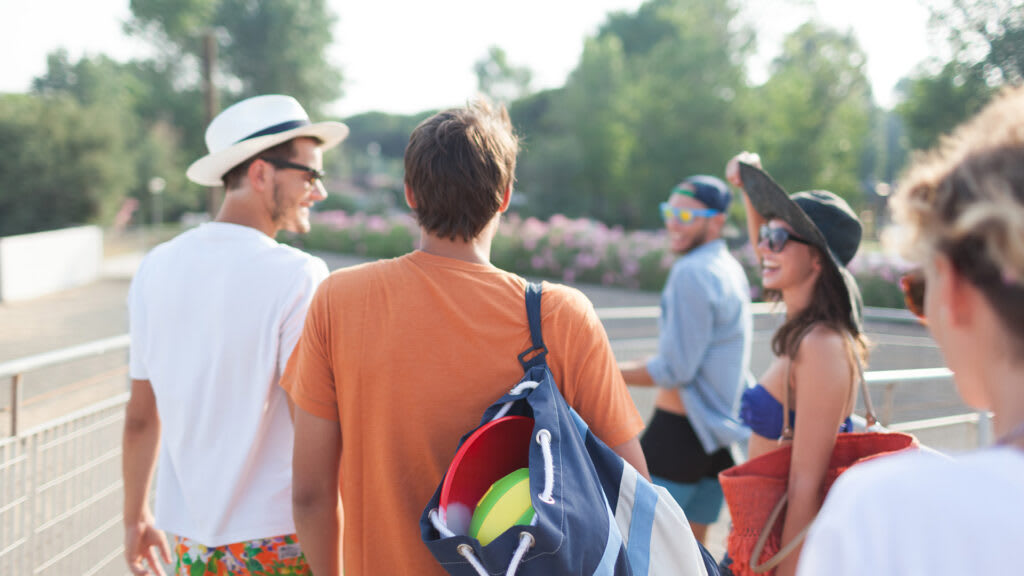 Friends walking to outdoor party