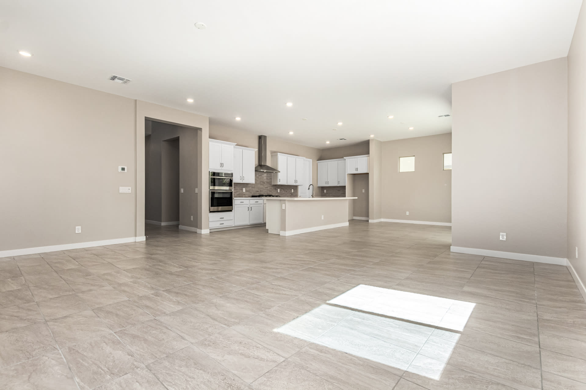Lot 5 | Great Room, Dining Room & Kitchen | Virgo Floorplan at Rialta | New Homes in Mesa, AZ by Landsea Homes