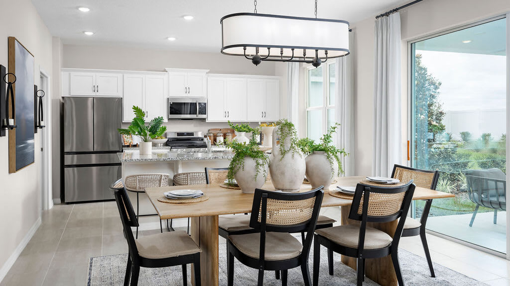 Dining Room & Kitchen Second Family Room | Cape | Hodges Reserve | New Homes In Howey-in-the-Hills, FL by Landsea Homes