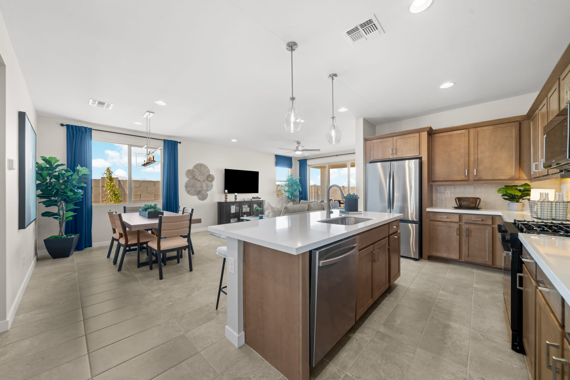Kitchen, Dining Room & Great Room | Radiance Floorplan | Elara at Moonlight | New Homes in Maricopa, AZ by Landsea Homes