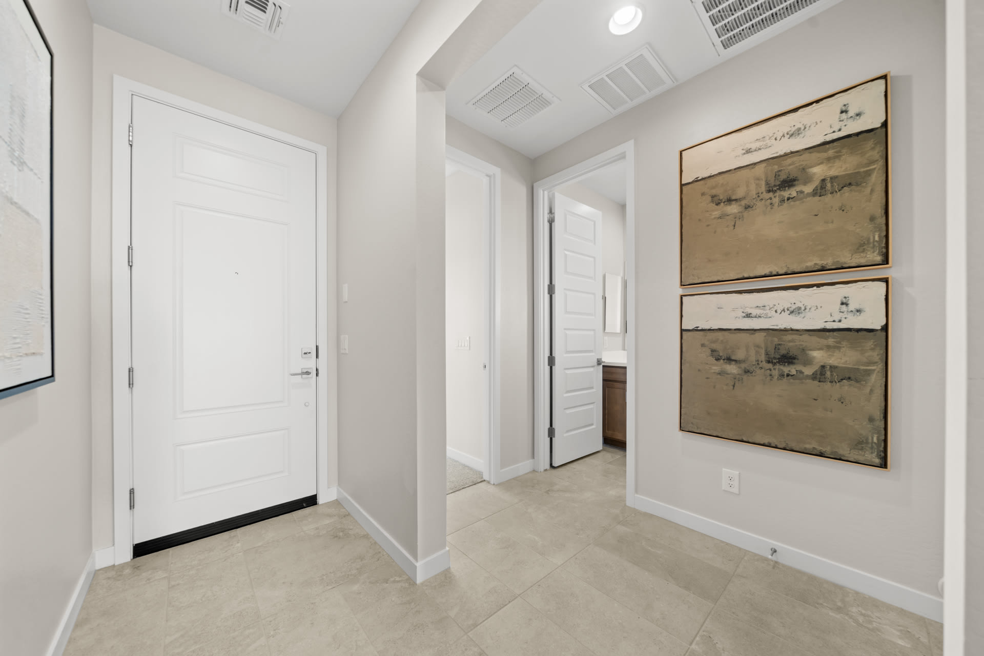 Front Door, Entry into Bed 3 & Bath 2 | Radiance Floorplan | Elara at Moonlight | New Homes in Maricopa, AZ by Landsea Homes