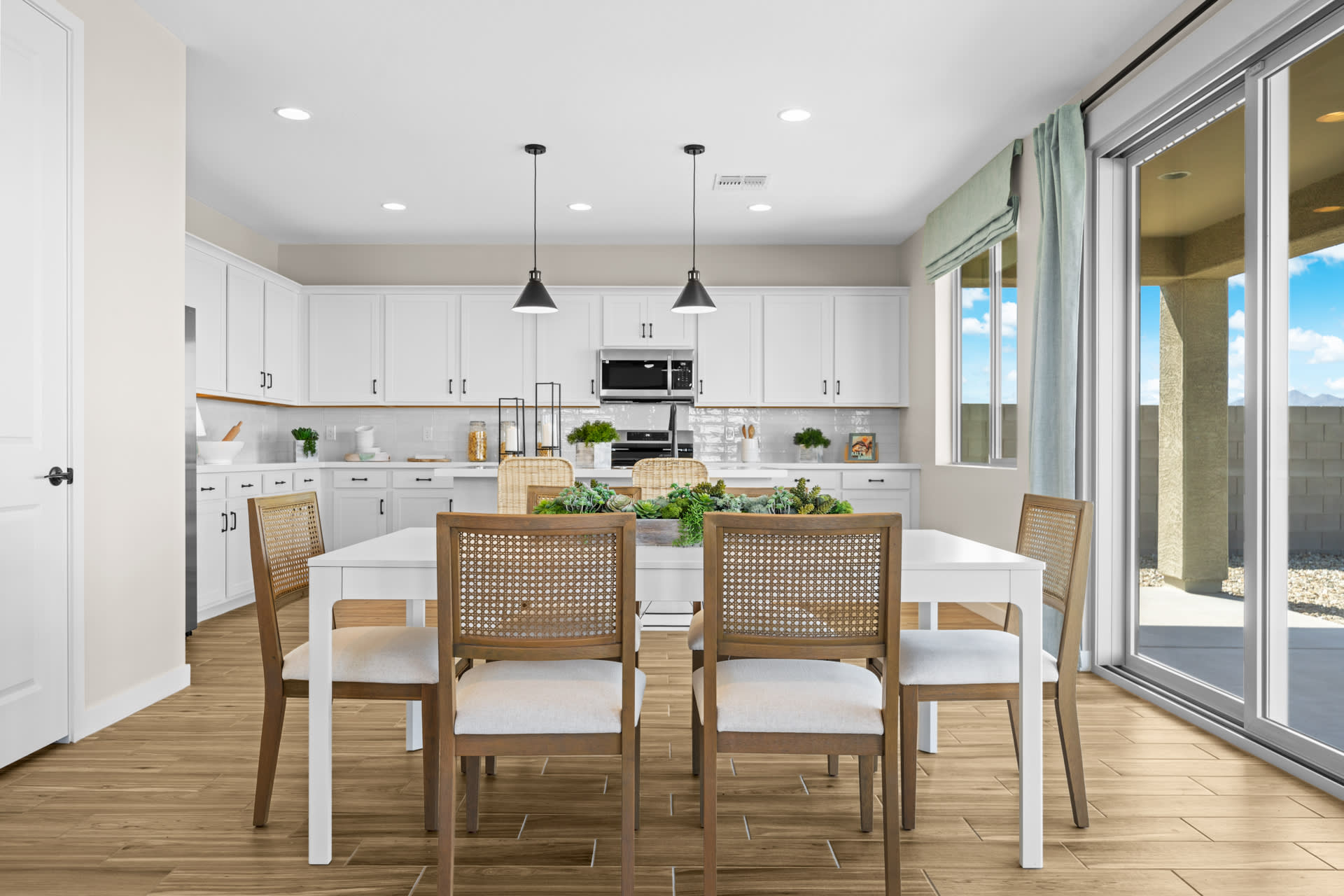 Dining Room & Kitchen | Skyline Floorplan | Elara at Moonlight | New Homes in Maricopa, AZ by Landsea Homes