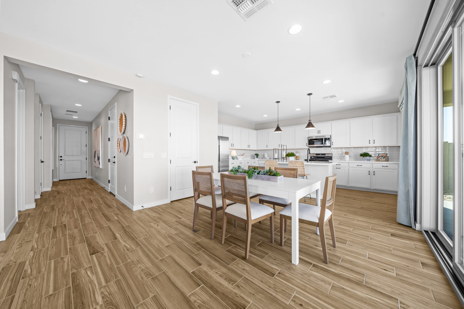 Dining Room & Kitchen | Skyline Floorplan | Elara at Moonlight | New Homes in Maricopa, AZ by Landsea Homes