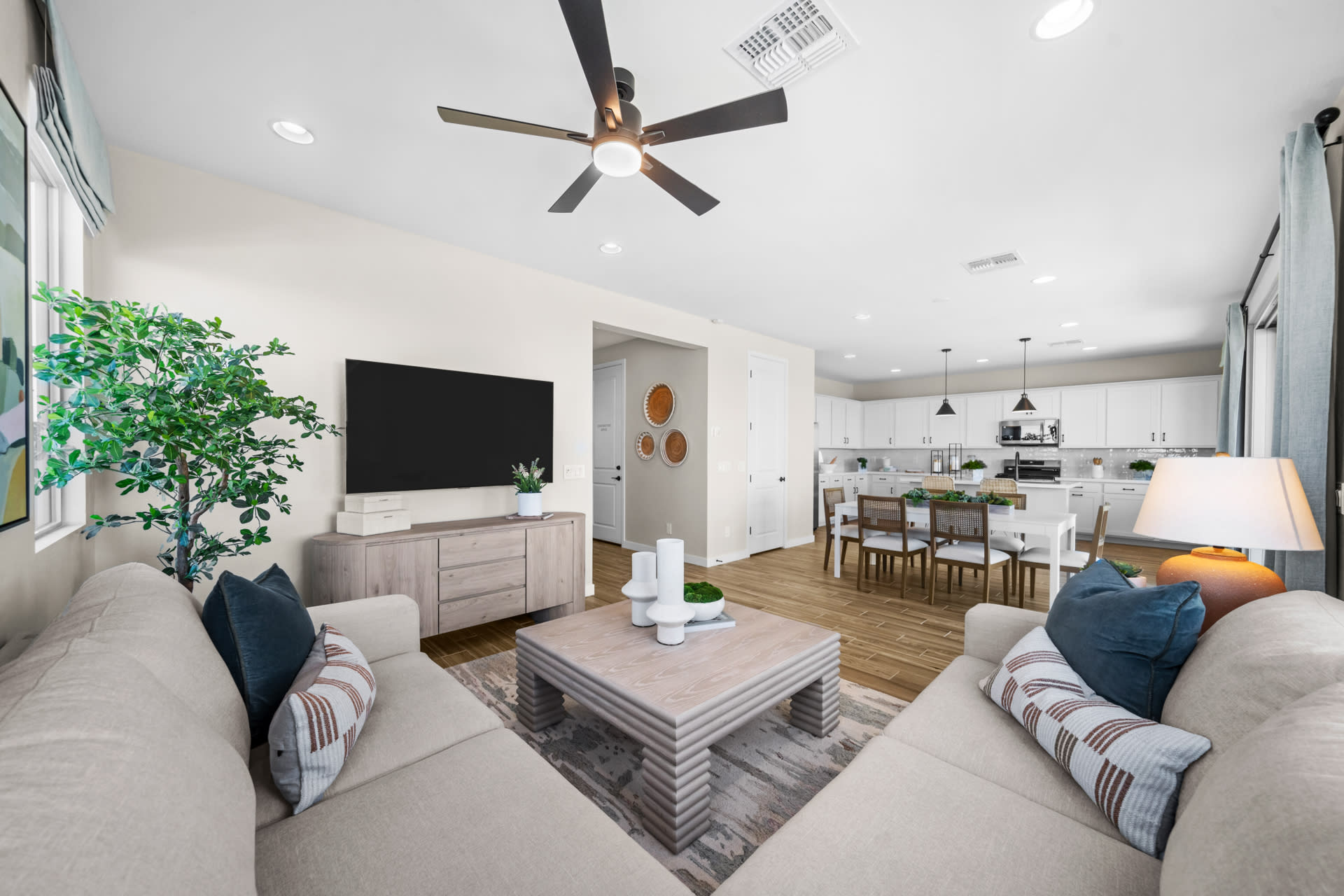 Great Room, Dining Room & Kitchen | Skyline Floorplan | Elara at Moonlight | New Homes in Maricopa, AZ by Landsea Homes