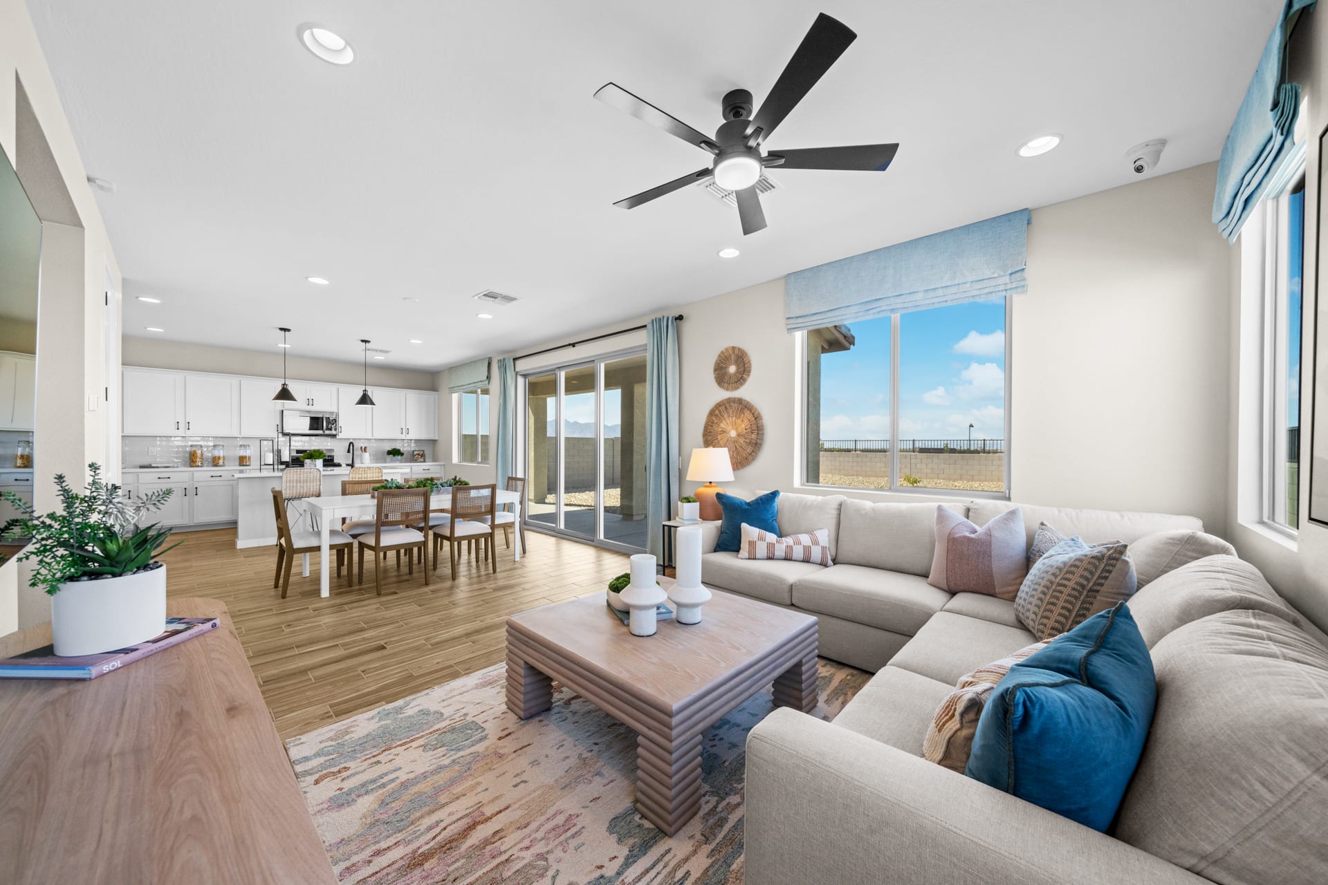 Great Room, Dining Room & Kitchen | Skyline Floorplan | Elara at Moonlight | New Homes in Maricopa, AZ by Landsea Homes