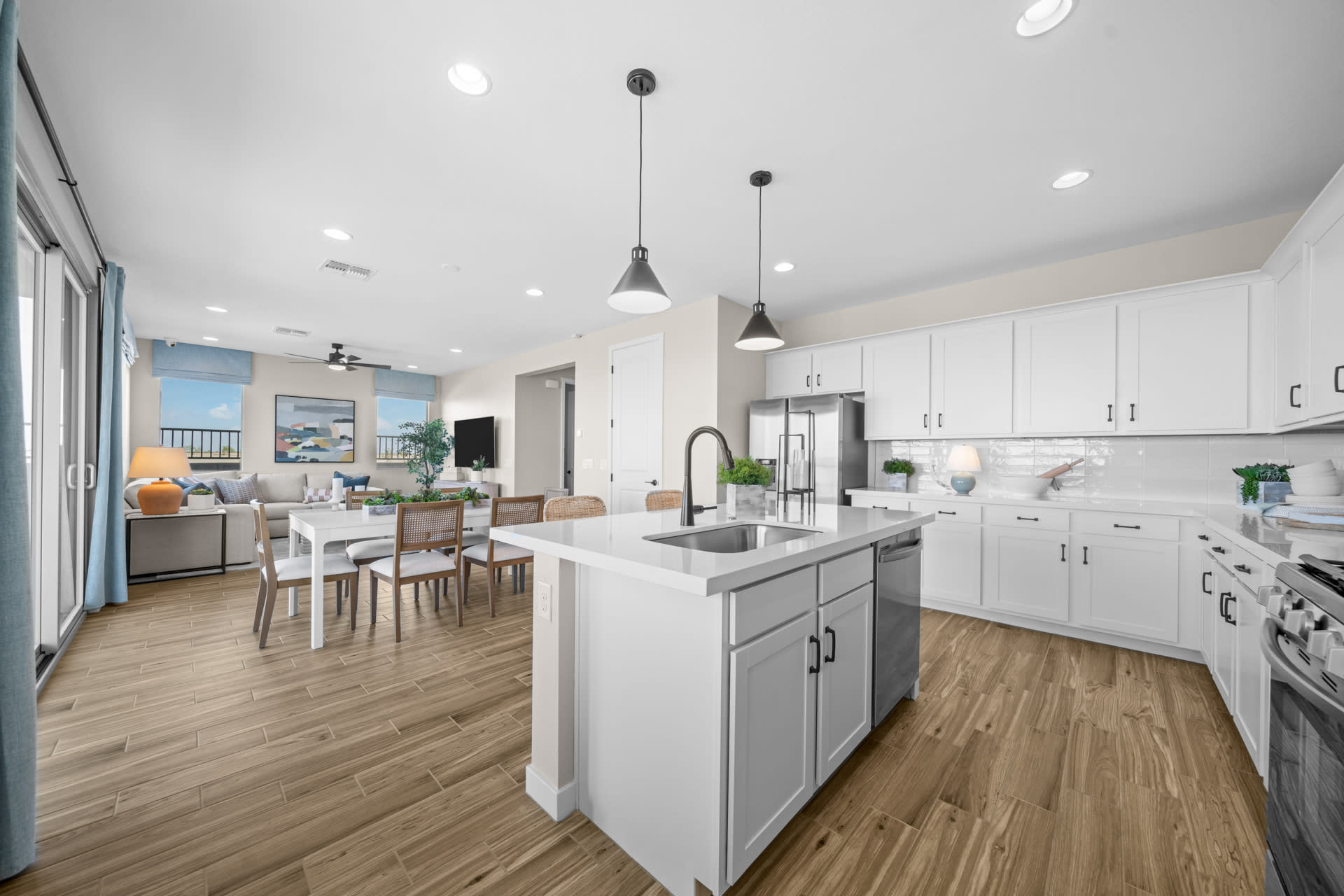 Kitchen, Dining Room & Great Room | Skyline Floorplan | Elara at Moonlight | New Homes in Maricopa, AZ by Landsea Homes
