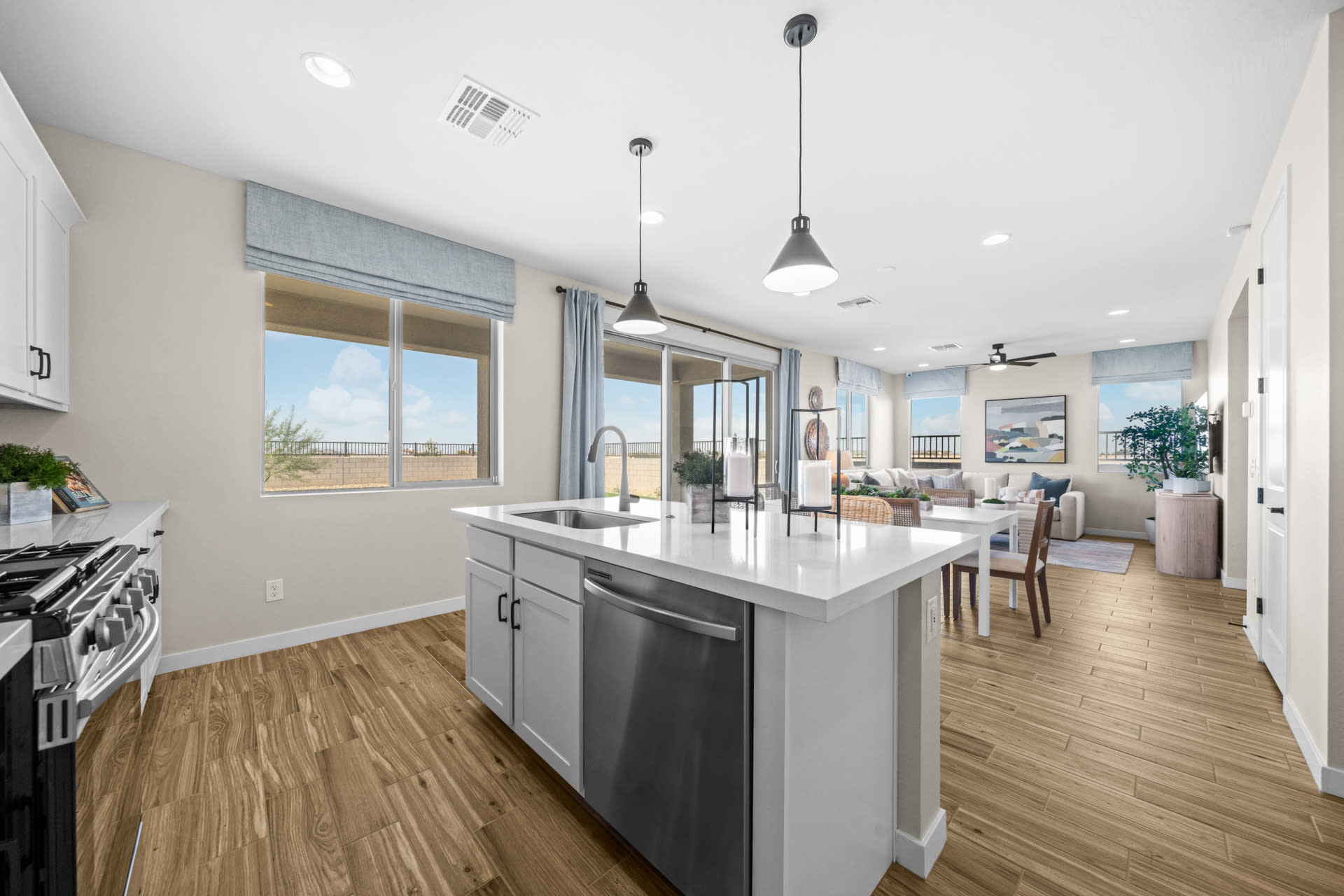 Kitchen, Dining Room & Great Room | Skyline Floorplan | Elara at Moonlight | New Homes in Maricopa, AZ by Landsea Homes
