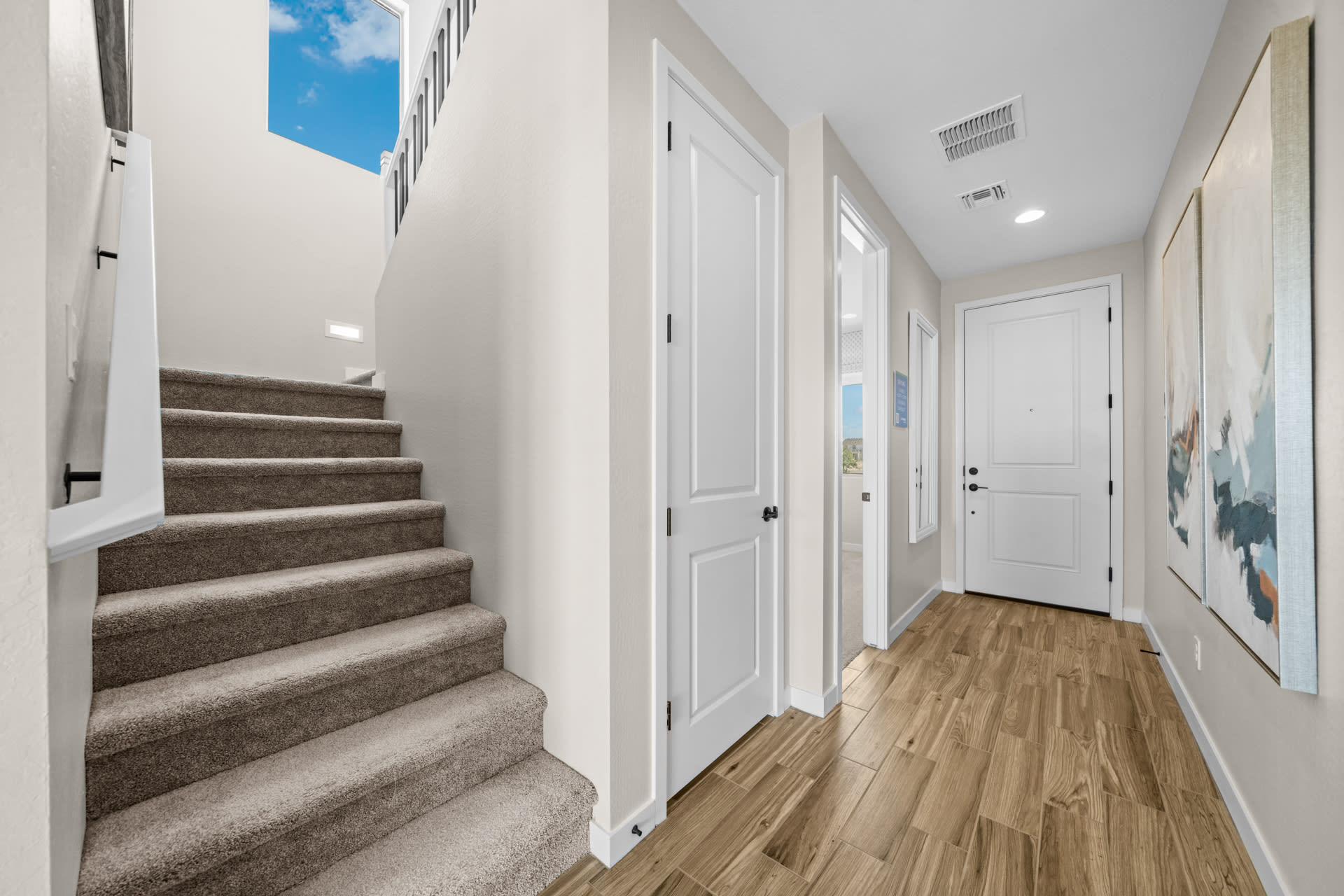 Staircase & Entry into Bedroom 5 | Skyline Floorplan | Elara at Moonlight | New Homes in Maricopa, AZ by Landsea Homes
