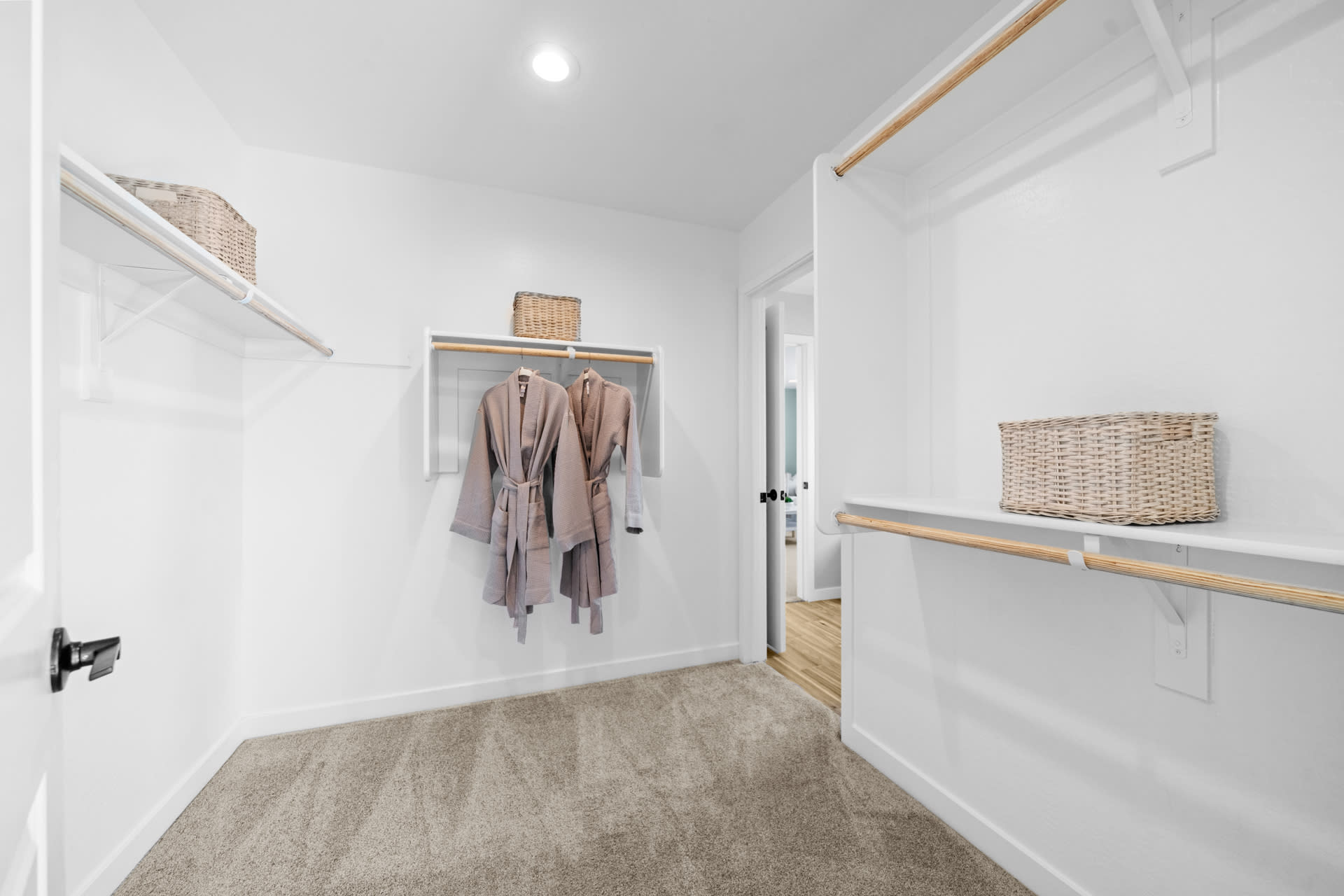 Primary Walk-in Closet with Door into Laundry Room | Skyline Floorplan | Elara at Moonlight | New Homes in Maricopa, AZ by Landsea Homes