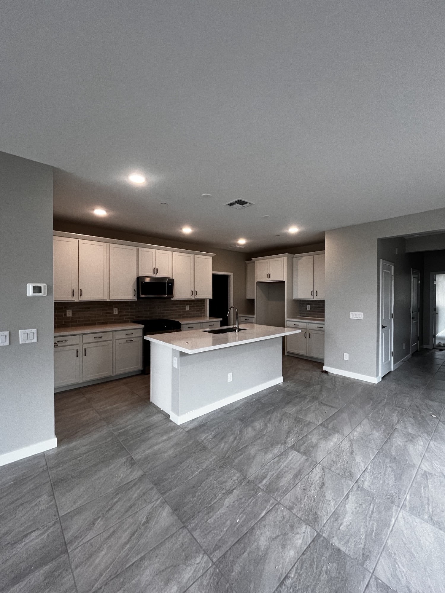 Lot 43 | Great Room, Dining & Kitchen | Mira Vista at Victory in Buckeye, AZ by Landsea Homes