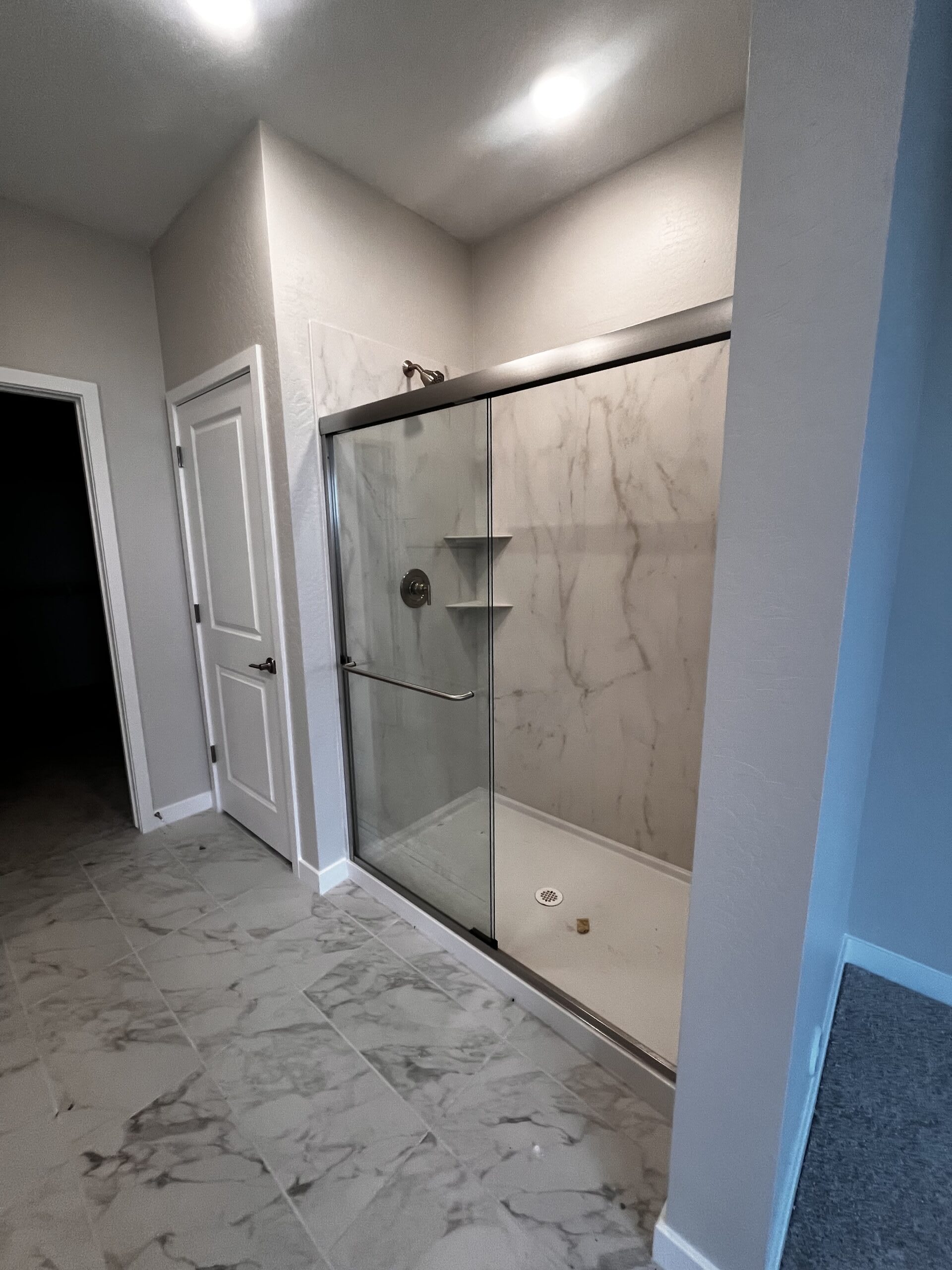 Lot 44 | Primary Walk-in Shower | Mira Vista at Victory in Buckeye, AZ by Landsea Homes