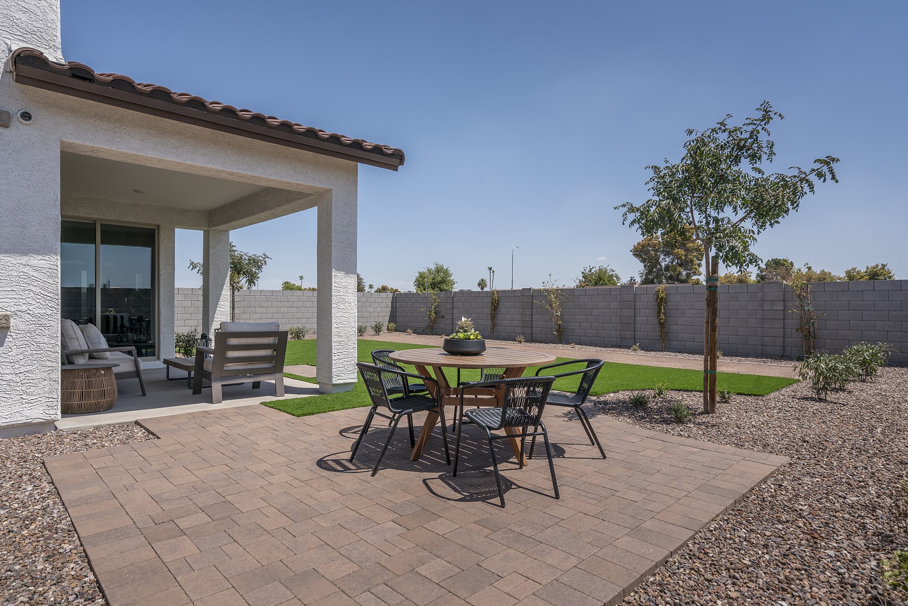 Backyard with Covered Patio | * Furniture Shown In Photo Not Included with Purchase of Home