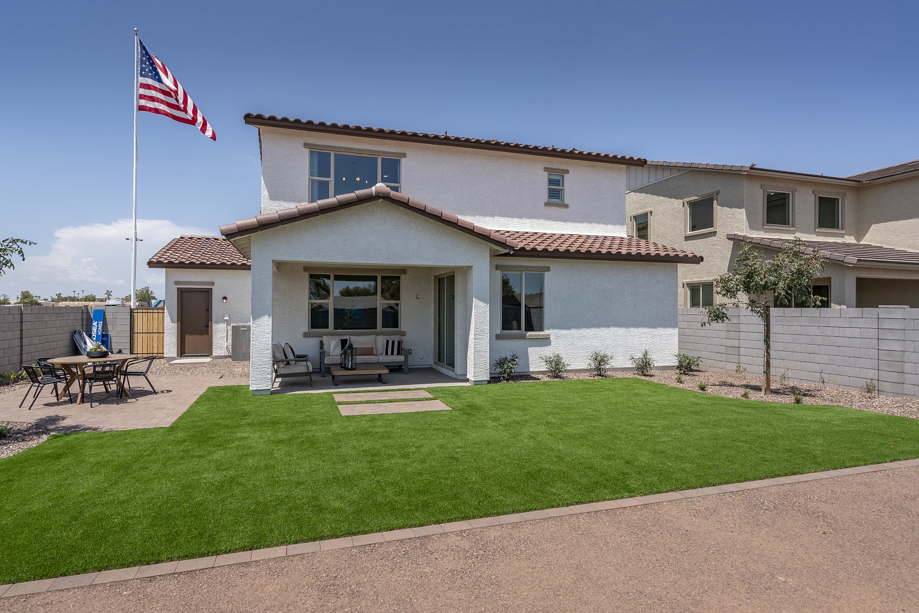 Backyard with Covered Patio | * Furniture Shown In Photo Not Included with Purchase of Home