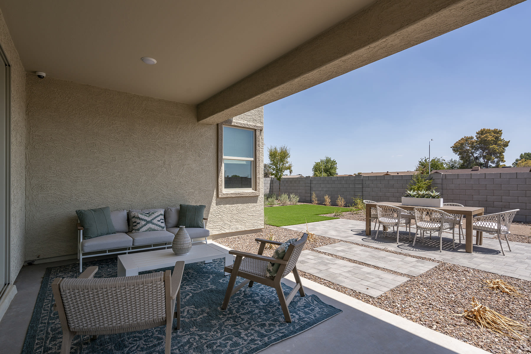 Covered Patio | * Furniture Shown In Photo Not Included with Purchase of Home