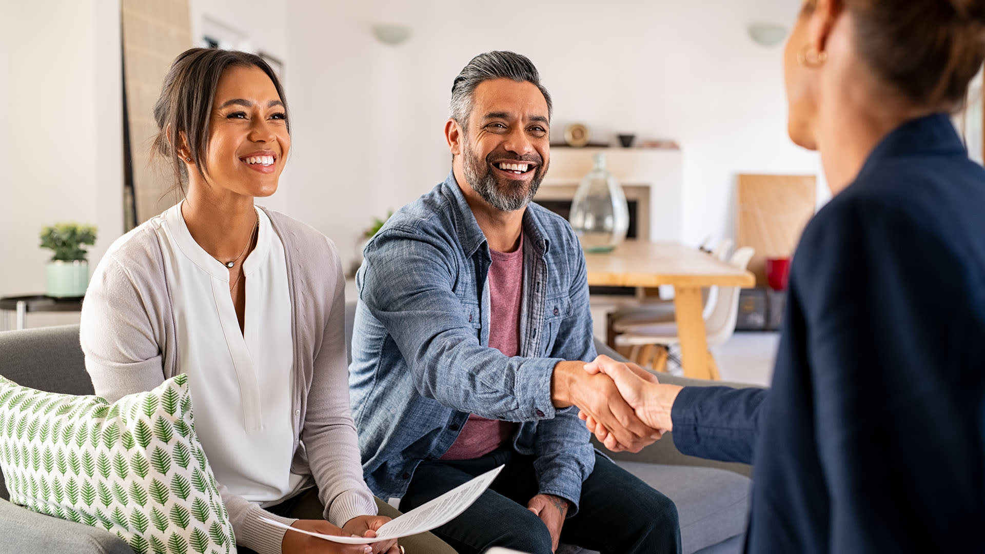 Couple getting mortgage help.